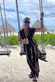 This cover-up is so flattering and cute. I got so many compliments! I think you could wear it as a dress, too. The slit is fun, and it worked great on vacation. - Jenna D.