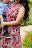 I ordered this dress for my engagement photoshoot and initially ordered a Small but after trying it on it fit too loose because of the elastic waist so i returned it and got an XS and it fit perfectly!! Im short so it did go longer than on the model shown, more like a maxi length than a midi but i expected that already and thought it still looked beautiful. Definitely recommend ordering a size down since the waist is stretchy!! Im very happy with my purchase and so glad i took a chance on it. I tend to stay away from dresses like this because theyre always too long or frumpy looking but this fit absolutely beautifully and i would buy again!! GETT ITT!! You wont regret it!! - Cristal L.