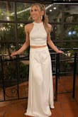 Wore this set to my wedding rehearsal dinner and felt like an actual goddess! The fabric is THICK, lined, and not see-through at all. Not to mention, SO COMFY! It was like wearing pajama bottoms all night. I am 5'3" and the pants were quite long on me, but unfortunately, I didn't have time to get it shortened so I wore about 4-inch heels..and it still dragged a bit. I also sewed in boob pads to add some shape and padding in the bust.
Overall I would highly recommend, this set is stunning for a bridal event. - RACHEL B.