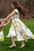 I am in love with this dress. It fits me true to size. I wore it on Easter and also for a mommy & me photoshoot. It was a windy day that day, but this dress looked GORGEOUS twirling! I want it in more colors. If you're on the fence, definitely buy it! - Kayla F.