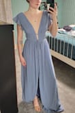 I love this dress so much! The material is light and comfortable and the fit is super flattering. I bought a handful of dresses to try for my sister's backyard wedding and while I didn't wear this one for the wedding, I am saving it for another occasion! Being able to comfortably move around in the dress was really important to me and I can easily do that in this dress, however, the sleeves regularly fell off my shoulders despite the grippy lining on the inside (think of the grippy strip in strapless bras). Can't have that happening, especially since it's dang near impossible to wear a bra with it. I am thinking I will wear this to my other sister's wedding next year but will have to get it hemmed and will probably try to use dress tape or maybe a thin fishing line in the back to keep the sleeves on my shoulders. Purchased XS and it fits really well otherwise!! - Grace W.