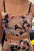 Maybe my order was a little defective? The top looks nothing like the one in the picture. The neckline on mine is straight across, too loose to be a square neck but too tight for a cowl. I'll keep it because I like the skirt but I don't think I'll wear the top - Casandra R.