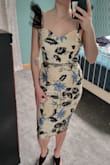 I was obsessed with this dress after seeing it! It's definitely bolder than what I would usually wear but I kept coming back to it. I decided to give it a try and while it's a gorgeous dress and fit like a glove I ultimately returned it for a few reasons. I was shopping for a dress for my sister's spring wedding and was already a little worried that it wouldn't be warm enough as it cooled off later in the night. Another big concern of mine was that I wouldn't be able to move around in it well enough when it came to dancing because the hem was fairly snug around my legs. And maybe this is just me being picky about the style on my body but I didn't love where the length hit on my legs either, I think I'm just too short for it. The straps were definitely outside my comfort zone. I think if I had worn it to the wedding I would have tried to iron them down a bit (kinda felt like a bearded dragon). l will say the quality was really nice though and I think it would be a super flattering dress on someone else! - Grace W.