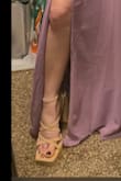 The quality was not impressive. I'm very sensitive to small details & I saw a small spot of excess glue & the straps were tight across the foot & not tight enough at the ankles. Latter ignored tho bc my ankles are quite skinny & bony.

They were okay to walk in, my foot didn't feel secure in that I could feel gravity pulling the shoe away from my heel when I lifted to step. I think it comes w/ the territory of chunky straps heels. However, I could feel a little friction at points around the ankle & my pinky toe on only one foot slipped out of the strap after walking.
Ultimately I returned them bc I needed a different height heel for my bridesmaid's dress, but I would have made them work out of laziness.
TL;DR 
quality 3.5/5
comfort (at try-on) 3/5
fit 3/5 just half a size too large
Only flattering on cute feet that aren't pointed like mine - Kathryn T.