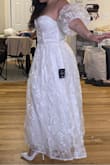 I loved how the model looked in this dress, and I knew I needed it for my bridal shower in two weeks. I ordered the medium because the size chart AND the size calculator both indicated I would definitely be a medium. Well, that was wrong and it barely zipped. So in a panic, I reordered a large one once it restocked. It came today and it is now a little too big on me. I still love the dress and my fiancé teared up when he saw me wear it, so I'm going to make it work for my bridal shower. Just wish the size chart was more accurate or that this was offered in more specific number sizes. Also, the outer layer fabric does feel a little cheap, and I don't think this dress is worth $94, maybe closer to $50? - Victoria W.