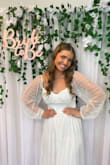 I bought this dress for my bridal shower and I love how it looked. It does run slightly large in the torso, but it isn't too bad, I feel if I went a size down it would be too small. The boob area fit was slightly off maybe bc I'm bigger chested but it wasn't noticeable. Overall I loved the dress, and if you have the time I do recommend ordering two sizes and seeing what fits best. - Rose J.