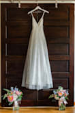 This gown was everything I wanted and more - flowy, gorgeous, comfortable, and affordable. I bought this dress at the last minute after having a crisis over my first gown. There was something about the first gown that just didn't feel like "me", but the second I put this one on, I knew it was the one. It fit me perfectly and didn't need alterations. I think if I would have purchased this gown further out from my date, I would have taken it to a tailor to have cups and boning put in on the bodice to give it a little more structure, but honestly, it was perfect as-is in my opinion. Would highly recommend it to other brides! - Holly S.