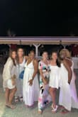 I ordered this outfit for my wedding welcome party event at the beach in Santorini, Greece! I told all the guests to wear white and then I showed up in this show-stopper cute colorful outfit!! Received so many compliments! I wrapped the tie top around the back to eliminate too much boob showing and I could wear a regular bra with it! The party continued with a girl's night out afterward, and I danced all night long in this outfit! I paired it with wedges. If you are short like me, wedges or heels are required. Will definitely need to be hemmed if you wear flats. After reading reviews, I ordered a small. I have a small waist with a big butt and thighs. Small fit PERFECTLY! - Ashlee K.