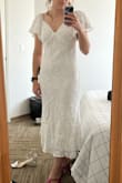 The dress is really pretty, but the cut is just really odd. The cups sit way higher than my actual boobs and since the dress doesn't have any internal support to give it shape, the cups just kind of float there. There was a lot of loose fabric at the front that bunched up. It could be that the fit was too big but I did follow the size guide! Looking back at the product photos, you can actually see that the model is using her hands to pull the dress tight against her waist so I'm not sure who this fit is supposed to be for. 

Overall it just looked kind of frumpy. Disappointed because I love the dress, but I will be returning it. - Cindy P.