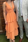 This was my second order of this dress as the color I wanted was only available in XS - since there is no give at all in the waistband, I had to return and get a S in a different color; however, I ended up loving the light orange! The top isn't ideal for someone with no boobs, but still very pretty! - Kaylee S.