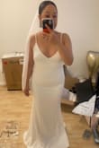 Absolutely the best wedding dress anyone can ask for! After searching a million bridal shops for this exact dress and failing miserably I gave up and purchased a different wedding dress for my destination wedding.  3 days before our destination wedding we find out it's going to not be raining but pouring!! I go into panic mode, expedite 3 Lulus dresses and absolutely fall in love when I try this one on. The material is thick with a little stretch for those of us that didn't worry about losing weight and extremely flattering. It was a bit long for me since I would not be wearing heels but it was an easy hem. If you want something simple and classic trust me and buy!!! If you need a little extra smoothing buy a pair of spanx. They work wonders! - Lupe V.