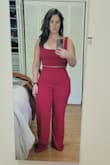 Absolutely loved this 2-piece outfit but it just didn't fit me right. The fabric is thick and stretchy everywhere but the waist. The waist was too high for my body type. It came just above my natural waistline so it rolled down. The pants were also way too long and the top was slightly bigger in the bust than what I would have wanted. - Kathleen S.