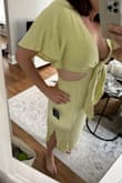 I love the color, love the shape, and cut but after ordering a M, it was still too tight on the waist. I ordered the L and the only thing that changed was the bust/tie area! The waist was the same, if not smaller, than the original M. Definitely disappointing and I wanted to keep this, I am almost tempted to order another L and see if it's sewn differently. No stretch, slightly see-through, but not for the wide waist gals. - Noelle K.
