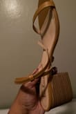 I was disappointed. I received LEATHER straps!! I only ordered them because of the picture. The heel wasn't attractive either. - Chantelle S.