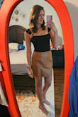 I love the color and overall length of the skirt. The material looks a little cheaper than I hoped, but I've still worn it twice. The slit in the front is very high! But not indecent. - Kelsey L.
