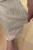 As others have mentioned, the button and clasp fell off when I tried them on. I knew I could sew the button back on so I went ahead and washed them according to the tag's instructions and hung to dry and to my surprise, the pants shrunk and now the lining is longer than the hem of the pants! Such a shame because they are so cute and I wanted to wear them on my honeymoon. - Emily C.
