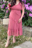 This dress was so beautiful and a hit for my good friend's wedding. It really clings to you. I did need to wear shapewear because the zipper would get caught at the seam without it. Also had my mom stitch the top higher as it showed a lot of cleavage. The color was beautiful and I would wear it again to another formal event. - Leslie C.