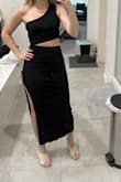 Great dress, I tried the tan and lavender first but they were too snug (still comfortable but lighter colors show more underclothing lines) This black one fits on the loose side so sizing isn't consistent but it will work just fine. Cute, interesting design, perfect for vacation or date night. - Katie M.