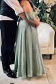 Bought this dress to wear to a formal spring wedding & got so many compliments! I am 10 weeks postpartum & it just barely fit me in the bust. The snap on the bust would not stay closed so I had my alterations add a hook & clasp there instead & it worked perfectly to keep in my chest! It is very long so I had to get it hemmed for sure! Unsure of my bra size since having a baby so I did not wear one with the dress but still felt very supported. It's very easy to move in & flowy! - Kimberly Q.