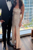 Wore this dress to a charity event and it did not disappoint! I'm tall (5'10) and still wore 2 in heels with it and the dress was long enough. The slit was a *little* high for my liking but my long legs are more to blame for that. Definitely recommend! - Melissa M.