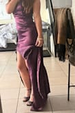 I wore this dress to prom and let me tell you, me and my man were looking so fine and ever-so fly. The color ended up being a perfect match to his suit. The slit was flattering but not too high up on my leg, the train was manageable I just had the bad luck of dummies around me. The material was so smooth and the light bounced off so perfect that it made the color look even richer. It was a bit loose however I blame the primary layer of the dress since it isn't meant to stick to the body like the underdress. Thankfully, the dress has adjustable straps but BE AWARE OF HOW TIGHT YOU HAVE THEM WHEN SITTING DOWN AND HAVING A HEAVY BOTTOM. I have a butt so when I went to sit in my passenger seat toward the end of the night the straps did bust out their seams. DO NOT LET THIS DISCOURAGE YOU FROM THE DRESS, Just keep in mind if you choose to tighten it!! Overall, I give it a good 9/10. Beautiful dress, amazing material, and arrived no less than a week later!! - Alina R.