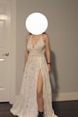 I purchased this dress after trying 6 others from Lulus. The dress is beautiful and the fit was almost perfect! It is very comfortable and lightweight.
There were a few things that I wasn't thrilled about with the fit. The straps were too long (and not adjustable) and the dress was very long.
I have a long torso so clasping the bodysuit was also a bit of a struggle. I bought the dress with the intention of replacing the bodysuit with a lining so it ultimately wasn't a problem.
I ended up getting the dress altered by shortening the straps, lining the skirt of the dress with a matching nude lining, and closing up the slit. I also had the front hemmed and left the back as is, turning it into a train.
The dress was perfect after the alterations but still beautiful without them. I've included a photo of the dress before the alterations and one afterward. - Saray F.
