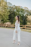 I'm between a S and a M and went with the Medium. I wish the neckline had been a little lower but I think it just fit me a little differently. If you wear a strapless bra be careful of sitting down, it will show in the back! Overall though, super super cute!! - Allie R.
