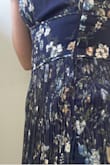 This dress is absolutely beautiful. I had been eyeing it for a long time for a May rooftop wedding and finally pulled the trigger. It was just as beautiful as pictured when I pulled it out of the bag. Sadly, when I put it on, the fabric around the zipper was a mess. The pleats around the zipper were uneven and not pressed, did not lay flat, and were noticeably bulgy. I love Lulus but the quality of the dresses do not match the price. Sadly I didn't have a backup dress to wear or I would have returned it - Cortney W.