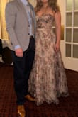 It was very difficult to find a formal floral dress, but this is it! So many compliments at the wedding. Photographs way darker than the pics provided, so you don't have to worry about it being too bridal! I'm tall 5'9"and in heels it was still dragging so probably needed a tailor visit. - Mike P.