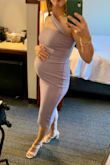 This was a perfect wedding guest dress for a spring/summer wedding. The fit was great and so comfortable even being 26 weeks pregnant (125lbs). I ordered my pre-pregnancy size (small) and there was enough stretch in the material to still fit around my bump. I probably could have gone up a size to a medium but then it may have been too long or too big in the bust/strap area. Like other reviews, the zipper was a little tough to pull up and the strap was a little too big, but didn't affect how much I loved the dress and look. I just tucked the extra strap in the back of the dress. - Brittany S.
