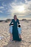 This fit well - a little large, but fine for this. Did a mommy and me shoot. The color is beautiful. I wish the back wasn't as open. Length was perfect though. - Emily M.