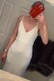 This fabric feels thick but still shows your stomach, and any prominent bones. Also the zipper down the back stops in a very unflattering spot on the butt. Don't really have anything good to say about this dress - Annika H.