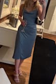 I did get it taken in around the chest and waist for a better fit since I have a larger bottom half and I am in between sizes. This dress is absolutely stunning on. I previously bought the burnt orange and knew I had to have another color. - Hannah L.