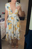 I'm so disappointed that I didn't read the reviews before purchasing. It's very tight up top and it drops way too low. This was supposed to be for my brother's wedding and I thought it would be very flattering and classy. Nope. Now I'm rushing around looking for a new dress to wear! The model dress is very misleading. I can't even sew a clasp there because then it's super tight. - Crystal D.