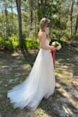 This dress worked beautifully for an outdoor wedding with its leafy embroidery design. Although I preferred the Fairytale Love Story Off Shoulder dress for its delicate flower tulle and design, I didn't have time to alter or exchange sizes. So...this was the one as it was versatile because of the lace-up back and the bottom was easy to hem with the plain tulle. Also, no issues with the top being too large if you have a small bust. No pads or bras needed. Overall, very happy. - Christina S.