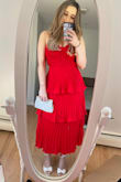 I absolutely loved this dress in red. I wore it to a few weddings as did my friends because they loved it so much. But I ordered this in the pink, same size, but it was two sizes smaller! I was so upset. I didn't take a picture of the pink since I couldn't even get it zippered. - Shannon F.