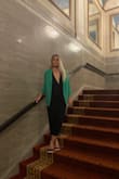 The material feels very light and cool/perfect for spring/summer! I wore it for my good friend's rehearsal dinner! Everyone loved my romper! Love the way it looks in the back. Didn't have a picture of it though! I also added light pop of color jacket to go with the romper for a cool night! The ankle ties were a perfect fit! Didn't have to wear a bra to go with it! - Julia H.