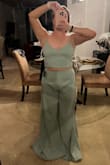 I was excited to get this - I don't typically buy one piece jumpsuits because it's hard to find the right fit so I thought this might be a good alternative. The bottoms were HUGE in the legs, but tight (with no stretch) at the waist. The weirdest part was how they bunched (even standing) in the groin area. I'm a DD and the top just flattened the girls, with little give as well. 

The quality was good and color accurate to the picture. Sorry to say I'm returning it. I tried uploading a picture but it won't work. - Lauren G.