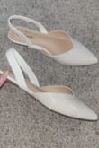 I thought these were gonna be stark white but they're actually almost a light cream or nude, which works in my favor. They're a tad small and squeeze my toes (like most pointed-toe shoes do) but I couldn't get a 9.5 and I think sizing up a full size would make the back strap too loose. Overall, happy with this shoe - Bethany G.