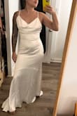 This is a very pretty dress, fabric is really nice feeling and looks expensive. I was looking for a similar dress without the cowl neck that has been sold out so wanted to give this one a try, but the cowl neck was a no for me. My smaller A-cup chest didn't seem to fill it right, but the lower half of the dress fit nice enough. The back was really pretty as well. - Vanessa T.