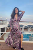 I wore this dress on a cruise and it looked stunning. It was flowy and felt comfortable. I bought the xs when I needed a small but I adjusted the back with a string and it still fit beautifully! The neckline looked elegant as well. - Lucinda D.