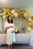 I loved this dress for my baby shower! It was super comfy, I felt really pretty, but also casual and it showed my bump perfectly. I will say though I am normally a small and sized up to a medium since I'm 8 months pregnant, but I think this would be too big once I'm not pregnant anymore. I would consider buying again to wear normally but would go with a small. Pre pregnancy weight I'm 5'7 and 138lbs. Also like other reviews, needs a good steam out of the bag as it's super wrinkly, but held up well throughout the event and after. - Alyssa R.