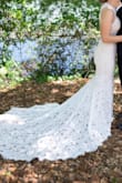 This dress was really beautiful! I am 5'0", 110lb and just had it shortened in a couple places. I had the waist brought up so that the slit wasn't weirdly low and it sat correctly on my hips. Then had it hemmed and the straps shortened slightly. I also had a five point bustle added. It photographs so well and I felt beautiful and comfortable in it all evening! - Adi H.