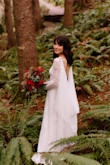 The dress fit me well, although it was very long for someone my height, even with heels on. But I felt like it fit my body type perfectly. I made a bridal cape to go with the look. My (now) husband absolutely loved it. I wish the white wasn't such a stark white color, but I think that was my only complaint about how it looked. Overall I can look back at my wedding photos and feel good about my choice. - Sheena S.
