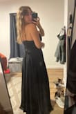 It fits great! Definitely too long though - It was probably 3 inches too long even with 4 inch heels. I also wish the slit was 1 - 2 inches higher. I bought it for a sorority formal and decided to go with the red version. Great black dress to have, though, would have kept it if I had the money for both. Overall I think I'm just a little too short for this dress. - Alex S.
