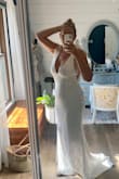 I bought this dress for my Hawaii beach vow renewal and it's perfect. Fits great and is flatter. It looks expensive. The train and the shoulder ties are the reason I bought it. - Charisse T.