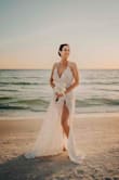 I bought 2 dresses from Lulus and both were beautiful.  It came down to the last hour and when I saw the beach that day I knew this was the dress.  I could feel it on but it wasn't heavy.  The lacework is beautiful.  I didn't have time to get it hemmed but it works for the beach and 2" inch heels for the reception.  If I had time to I would have closed up an inch or 2 of the slit.  Great dress to photograph in. - Steph W.