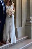 I wore this dress for our simple city hall wedding. Loved the fit and it turned out great in pictures. The dress was long on me even with 3 inch heels. Wouldn't want the slit to be any higher in the front. Super comfortable and easy to wear. The tie straps make the dress easy to adjust for a customizable fit. - Shelby R.