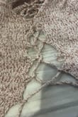 This is a cute sweater top, but it completely UNRAVELLED when I hand-washed it. I should have just washed a $50 bill because it was a complete WASTE. Don't bother with this one! - Lindsey Y.