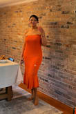 Bought this dress for a business shower where the theme color was orange. I wish it was a little more fitted in the waist but not sure that's possible with the crochet material. The elastic held up and everything stayed in place all day. - Shelley J.